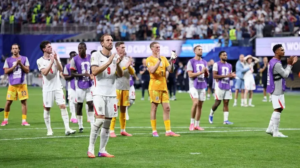 England players on the field applauding the fans after the World Cup semi-final defeat to Argentina