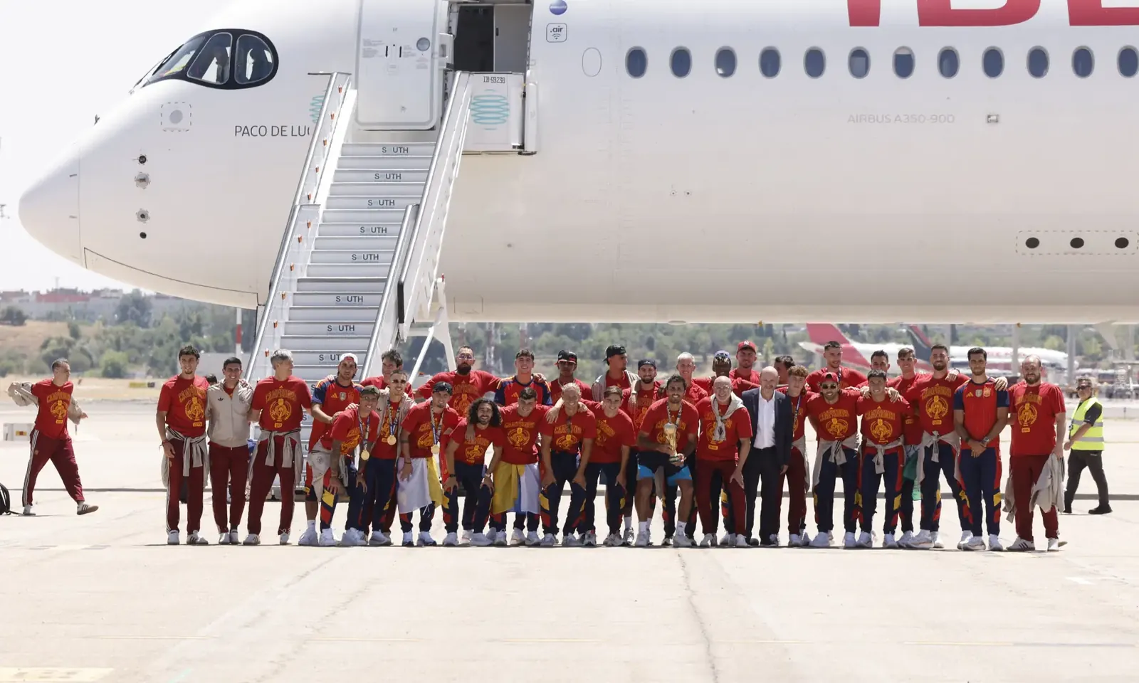 Spain's team pose with their trophy on the tarmac upon their arrival from the US after winning the 2026 World Cup, in Madrid Barajas' airport, on July 20, 2026. — AFP