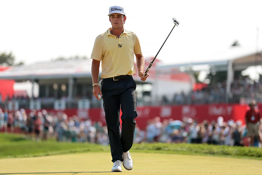 Jackson Koivun of the United States walks off the 18th green